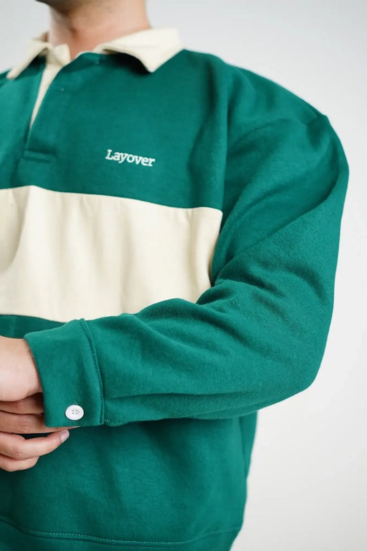 Green and beige rugby shirt with 'Layover' text on a white background